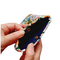 Hands holding open a Kindle Paperwhite sleeve with a gold snap showing the inside lining of the sleeve with is made with a solid navy blue.
